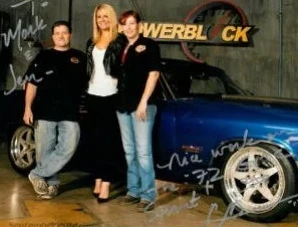 A signed PowerBlock TV set photo with the family and a custom blue build