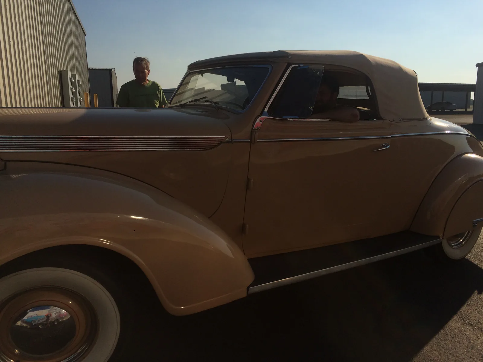 Black Betty as found in 2017 — beige paint, tan top, outside the shop at dusk.